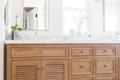 Inspiration for a transitional master bathroom remodel in Santa Barbara with louvered cabinets and brown cabinets