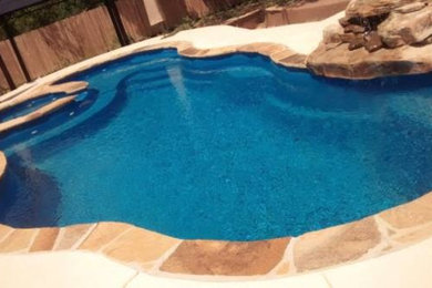 Inspiration for a mid-sized backyard stone and custom-shaped natural pool fountain remodel in San Francisco