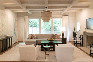 Family room - large traditional open concept medium tone wood floor and coffered ceiling family room idea in Birmingham with white walls, a standard fireplace, a stone fireplace and a wall-mounted tv