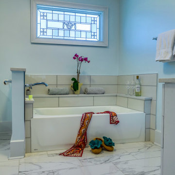 Custom Bath with tile walls and stone wine shelf