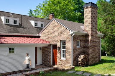 Mid-sized farmhouse white one-story mixed siding exterior home idea in Raleigh with a mixed material roof