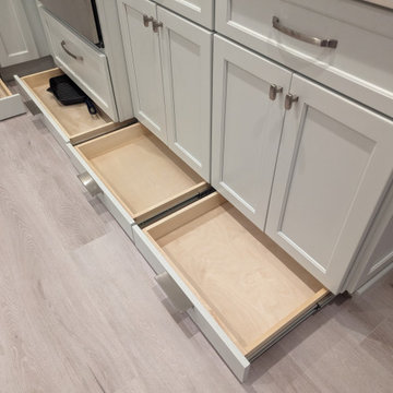 Small kitchen with storage options in toe kick