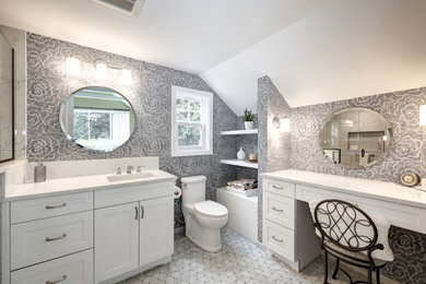 Inspiration for a timeless master black and white tile single-sink, mosaic tile floor, gray floor and wallpaper alcove shower remodel in Portland with shaker cabinets, white cabinets, quartz countertops, white countertops, a built-in vanity, a one-piece toilet, gray walls, an undermount sink, a hinged shower door and a niche