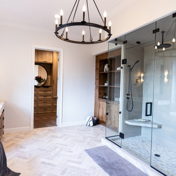 Vanity area with glass-enclosed shower beyond