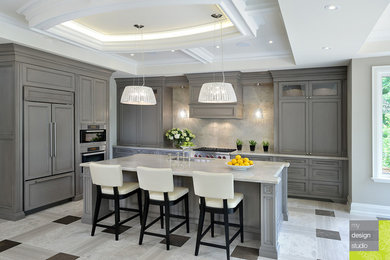 Mid-sized transitional l-shaped marble floor open concept kitchen photo in Toronto with an undermount sink, shaker cabinets, gray cabinets, quartzite countertops, beige backsplash, stone slab backsplash, paneled appliances and an island