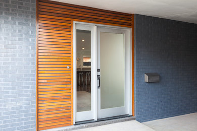 Design ideas for a midcentury entryway in Denver.
