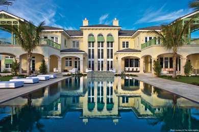 Example of a beach style home design design in Miami