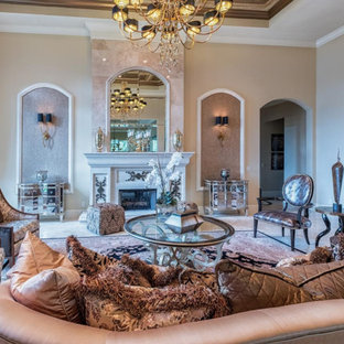 Design ideas for a large mediterranean formal enclosed living room in Miami with beige walls, porcelain flooring, a standard fireplace, a concrete fireplace surround, no tv and beige floors.