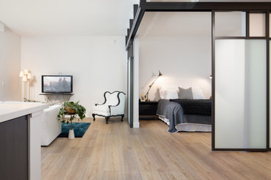 Inspiration for a mid-sized contemporary vinyl floor and yellow floor bedroom remodel in San Diego
