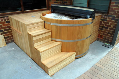 Cedar Hot Tub installation with custom made stairs and enclosure