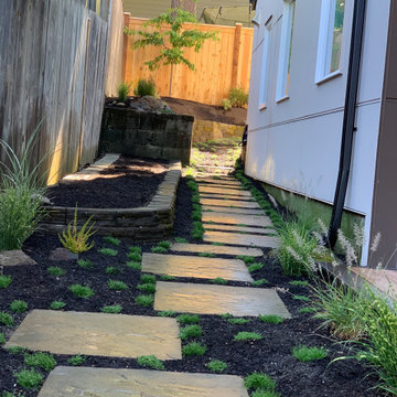 Deck platform, fence, hardscape, garden and planters.