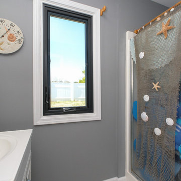 Beach-Themed Bathroom with Black Casement Window - Renewal by Andersen Georgia
