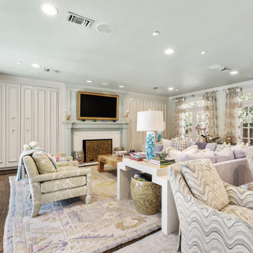 Spacious and Elegant Living Room with Floor-to-Ceiling Windows and Vibrant Patte
