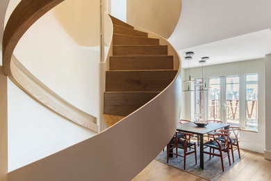 Example of a mid-sized minimalist wooden floating wood railing staircase design in New York with wooden risers