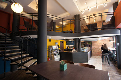 Home design - mid-sized industrial home design idea in Other