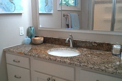Bathroom - small transitional white tile and porcelain tile ceramic tile and beige floor bathroom idea in Other with shaker cabinets, white cabinets, beige walls, granite countertops, a hinged shower door and brown countertops