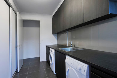 Inspiration for a contemporary laundry room in Brisbane.
