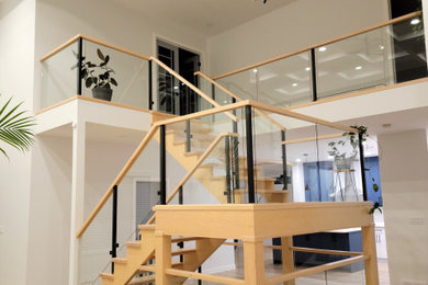 Staircase - mid-sized contemporary staircase idea in Edmonton