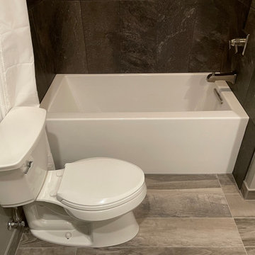 BATHROOM - New Tub, 12x24 Brown Tile, Gray Plank Floor Tile, Tebas Black Granite