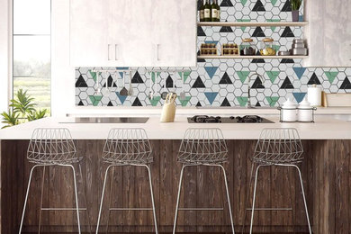 Example of a small trendy single-wall dark wood floor and brown floor open concept kitchen design in Other with flat-panel cabinets, gray cabinets, quartz countertops, multicolored backsplash, an island and white countertops