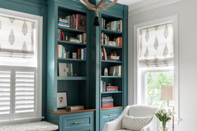 Home office library - mid-sized transitional built-in desk dark wood floor home office library idea in Philadelphia with white walls
