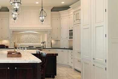 Large transitional l-shaped marble floor eat-in kitchen photo in Toronto with an undermount sink, beaded inset cabinets, white cabinets, quartz countertops, white backsplash, cement tile backsplash, paneled appliances and an island