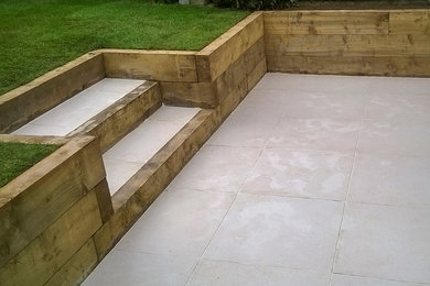 Inspiration for a small modern garden in London with concrete paving.