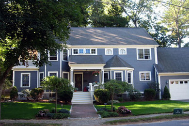 Example of a large ornate blue two-story wood exterior home design in Boston