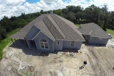 Inspiration for a large craftsman gray one-story exterior home remodel in Orlando