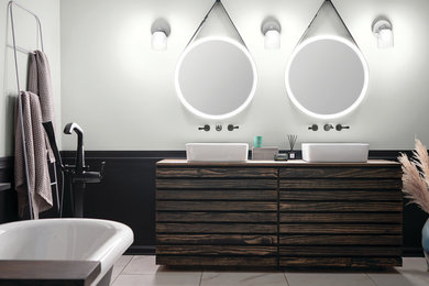 Inspiration for a large contemporary master porcelain tile and white floor claw-foot bathtub remodel in Other with furniture-like cabinets, brown cabinets, white walls and a vessel sink