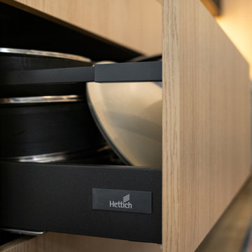 Sophisticated matte black and warm rift cut oak collision