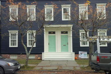 Traditional black two-story wood exterior home idea in Boston