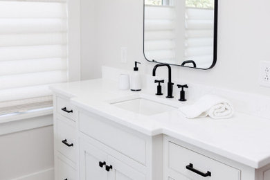 Inspiration for a large craftsman master white tile and marble tile marble floor, white floor, single-sink and shiplap ceiling bathroom remodel in New York with beaded inset cabinets, white cabinets, a two-piece toilet, white walls, an undermount sink, quartz countertops, white countertops and a built-in vanity