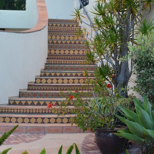 Inspiration for an expansive mediterranean tiled staircase in San Diego with tiled risers.
