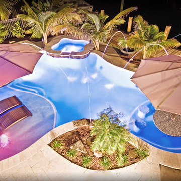 LED Lights on Lagoon/Freeform Pool With Sun Shelf and Bar Area in Fort Lauderdal