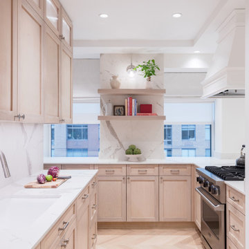 Custom wood cabinetry kitchen with marble backsplash