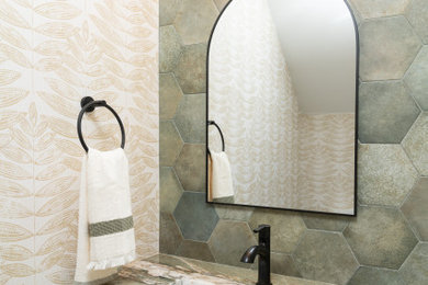 Example of a trendy green tile powder room design in Boise with light wood cabinets, quartzite countertops, green countertops and a built-in vanity