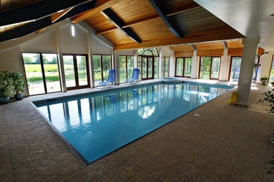 Design ideas for an indoor custom shaped swimming pool in Kent.