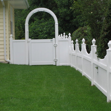 WHITE SOLID FENCE WITH ARBOR and picket fence