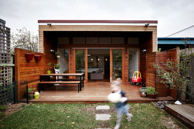Mid-sized contemporary brown exterior in Melbourne with wood siding.
