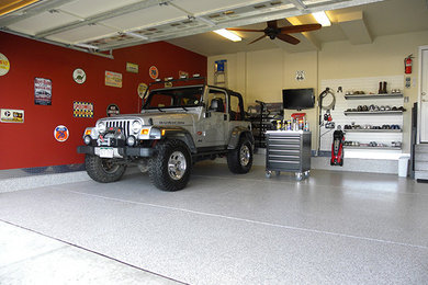 Example of a large classic attached two-car garage workshop design in Denver