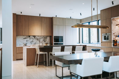 Example of a large minimalist l-shaped eat-in kitchen design in Baltimore with an undermount sink, flat-panel cabinets, brown cabinets, paneled appliances and an island