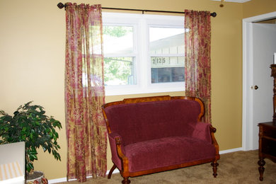 Inspiration for a mid-sized timeless carpeted home office remodel in Chicago