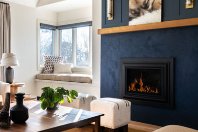 Large transitional loft-style vaulted ceiling and wainscoting living room photo in Providence with blue walls, a standard fireplace and a plaster fireplace