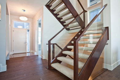 Minimalist carpeted straight open staircase photo in Calgary