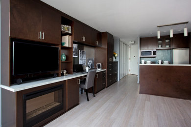 Example of a small trendy open concept laminate floor and beige floor living room design in San Francisco with blue walls, a ribbon fireplace and a wall-mounted tv