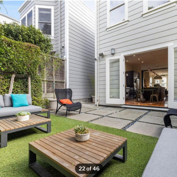 Child-Safe Backyard Extends Chic Indoor Entertainment Area