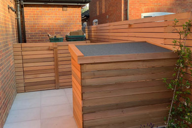 Modern garden in Other with natural stone paving.