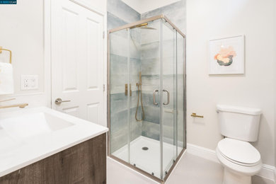 Bathroom - blue tile and ceramic tile single-sink bathroom idea in San Francisco with distressed cabinets and quartz countertops
