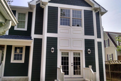 Example of a large classic gray two-story wood exterior home design in DC Metro with a shingle roof